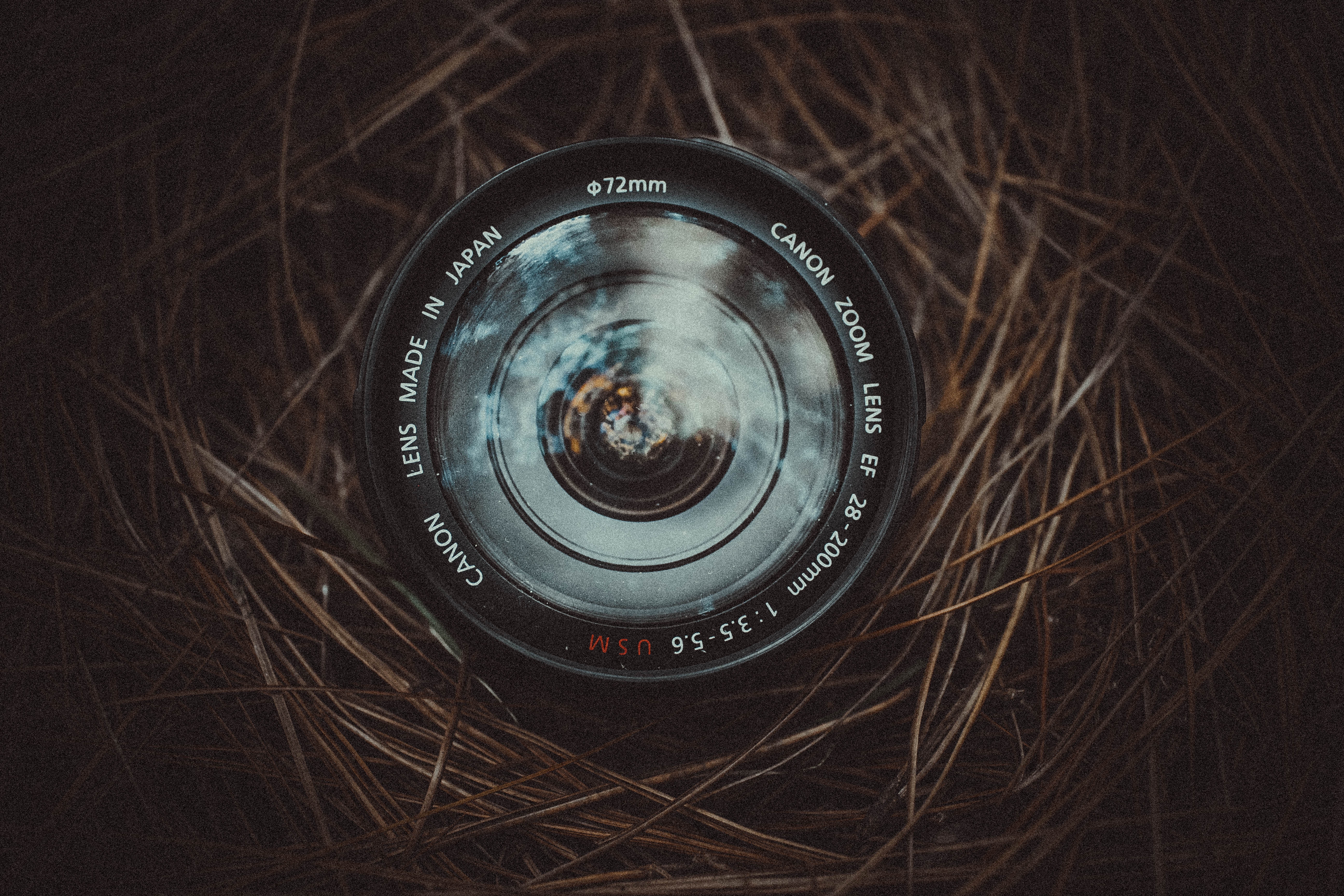 Lens in nest showing focal lengths, aperture and diameter. 
